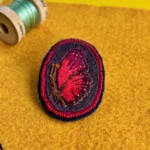 Broche papillon rouge
