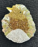broche oiseau dorée